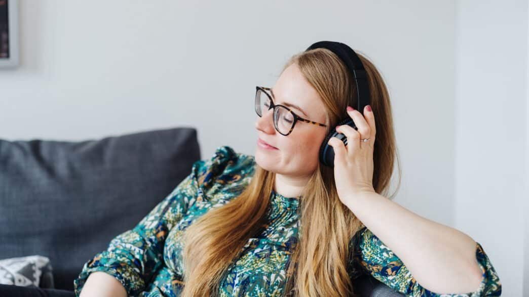 Young woman daydreaming while listening to music