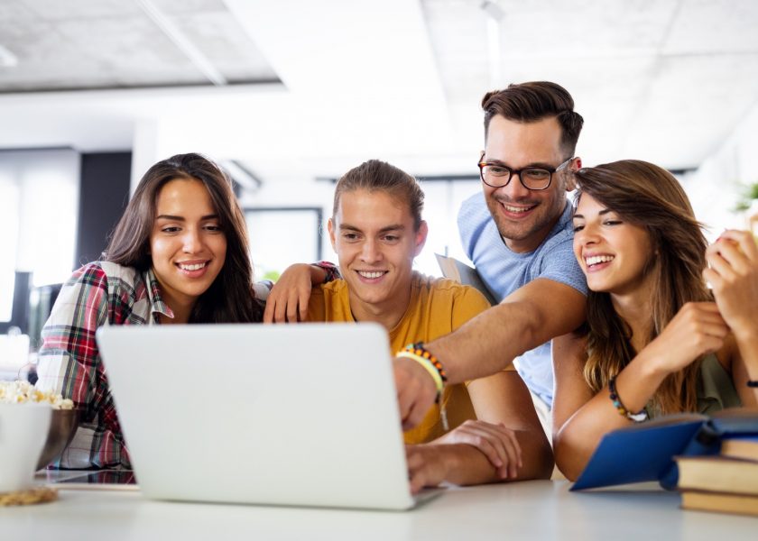 multiracial-young-people-enjoying-group-study-at-table-picture-id1276383007