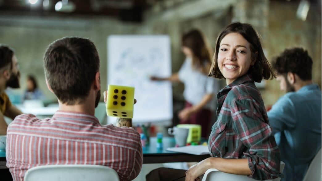 happy-creative-woman-on-a-presentation-with-her-colleagues-in-the-picture-id1400411472-1044×587